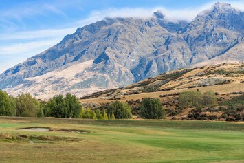 Scenic Golf Course with Stunning Mountain Backdrop