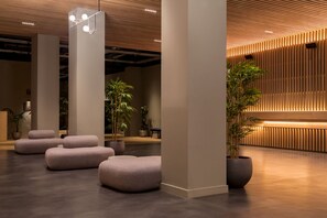 Relax in the lobby's serene atmosphere, surrounded by natural elements and comfortable seating areas.