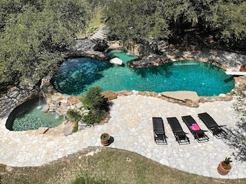 Absolutely amazing country club style 12' pool with a diving board and BBQ area